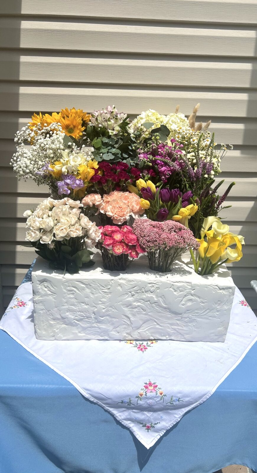 Finished bridal shower bouquet holder filled with flowers