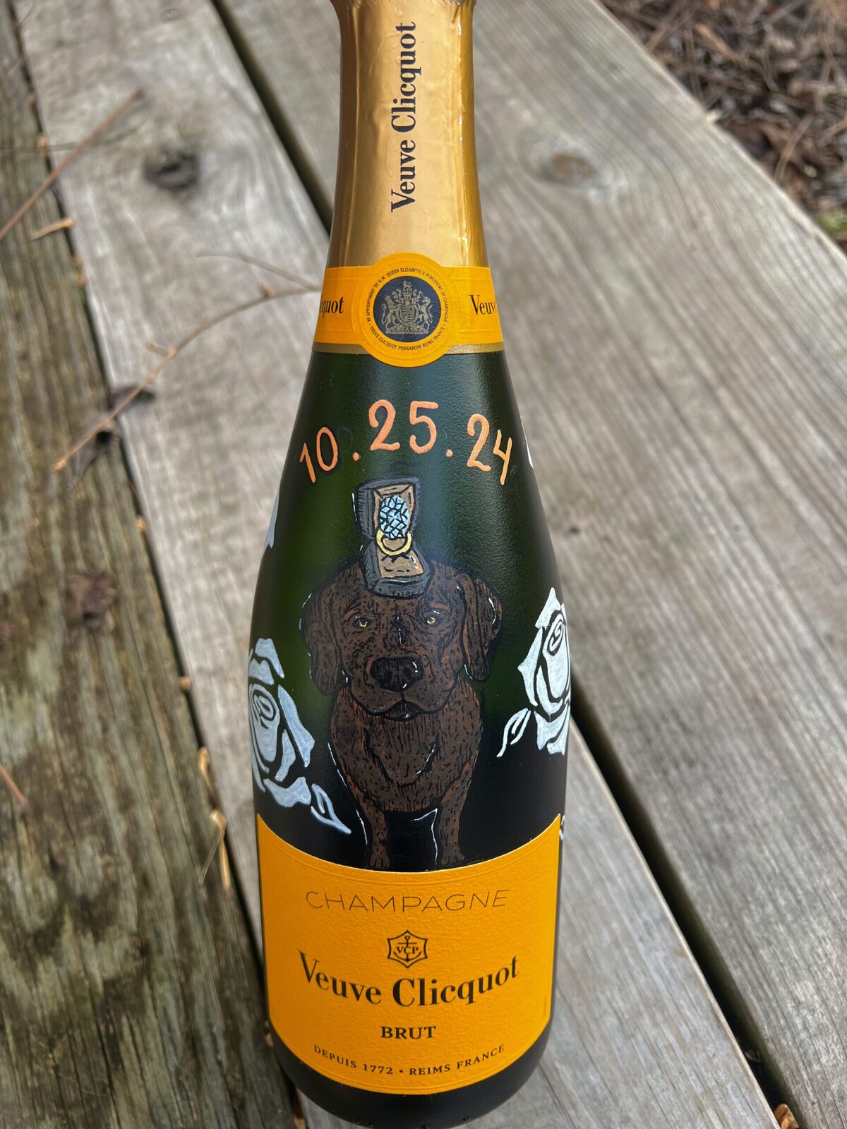 Hand-illustrated champagne bottle with painted dog and floral motif as a bride-to-be gift