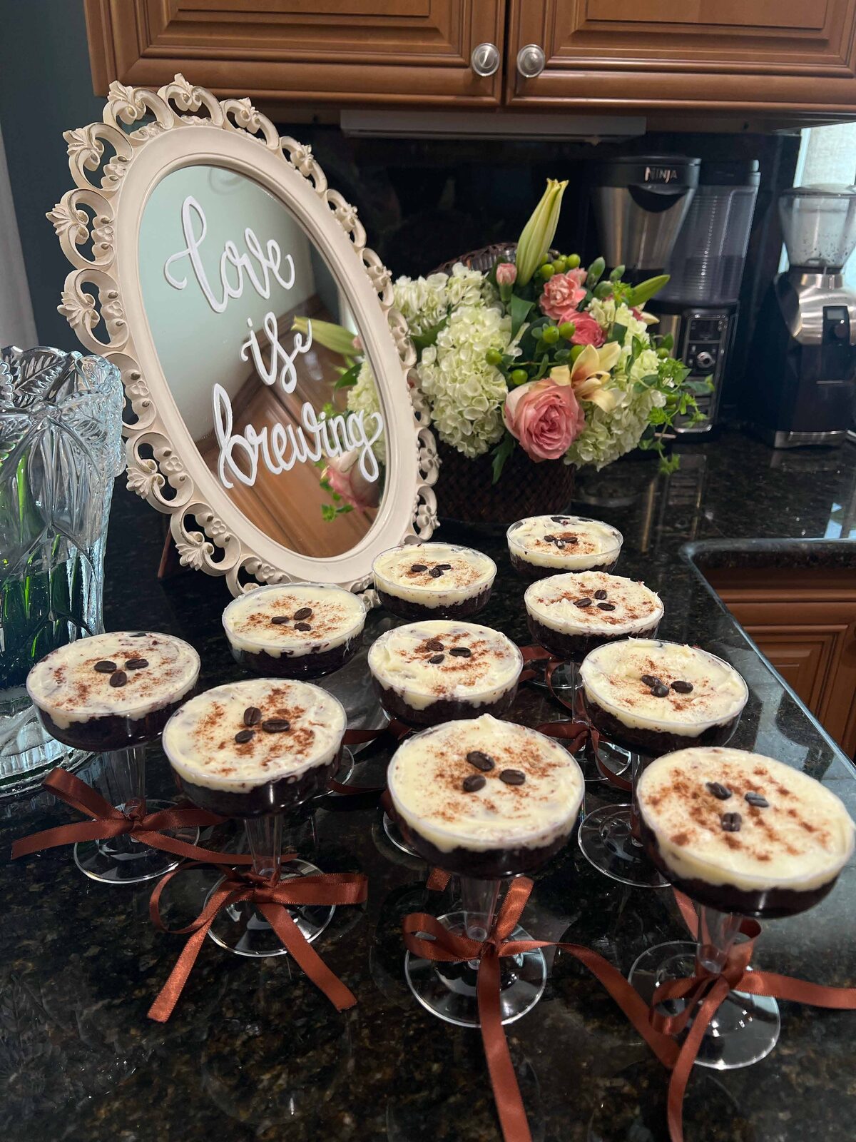Love Is Brewing bridal shower mirror displayed with pie favors
